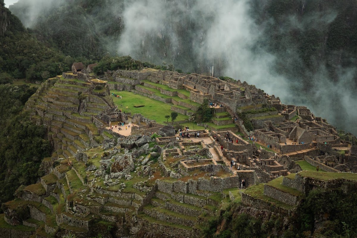 Machu Picchu surrounded by misty mountains in Peru